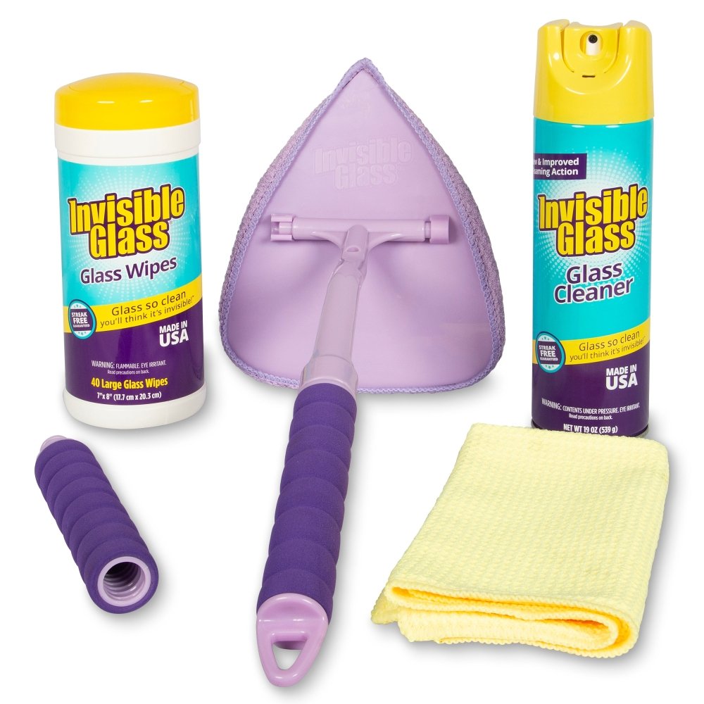 Cleaning products including aerosol can, wipes, and cloths on a white background
